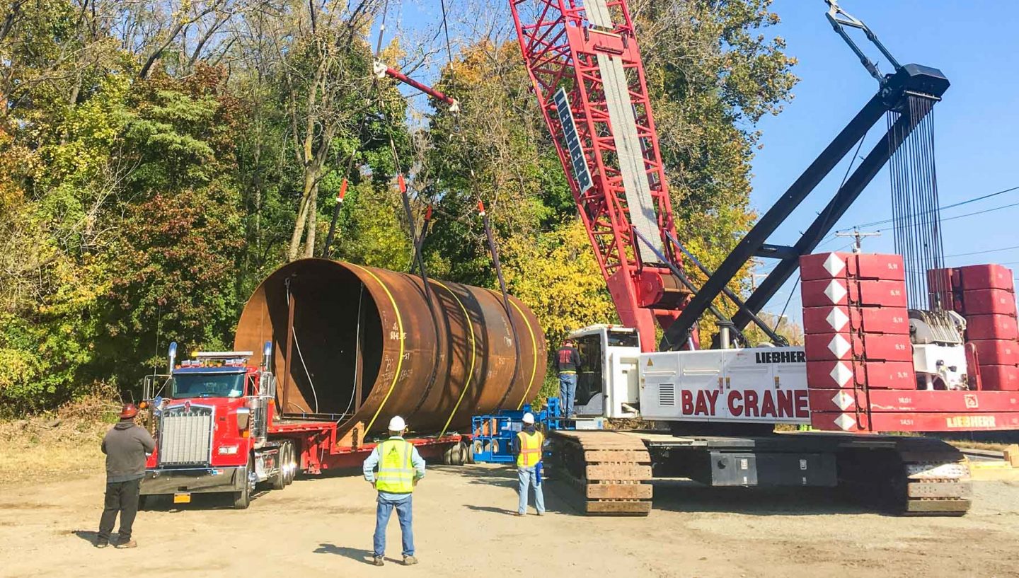 Crane and truck carrying heavy load