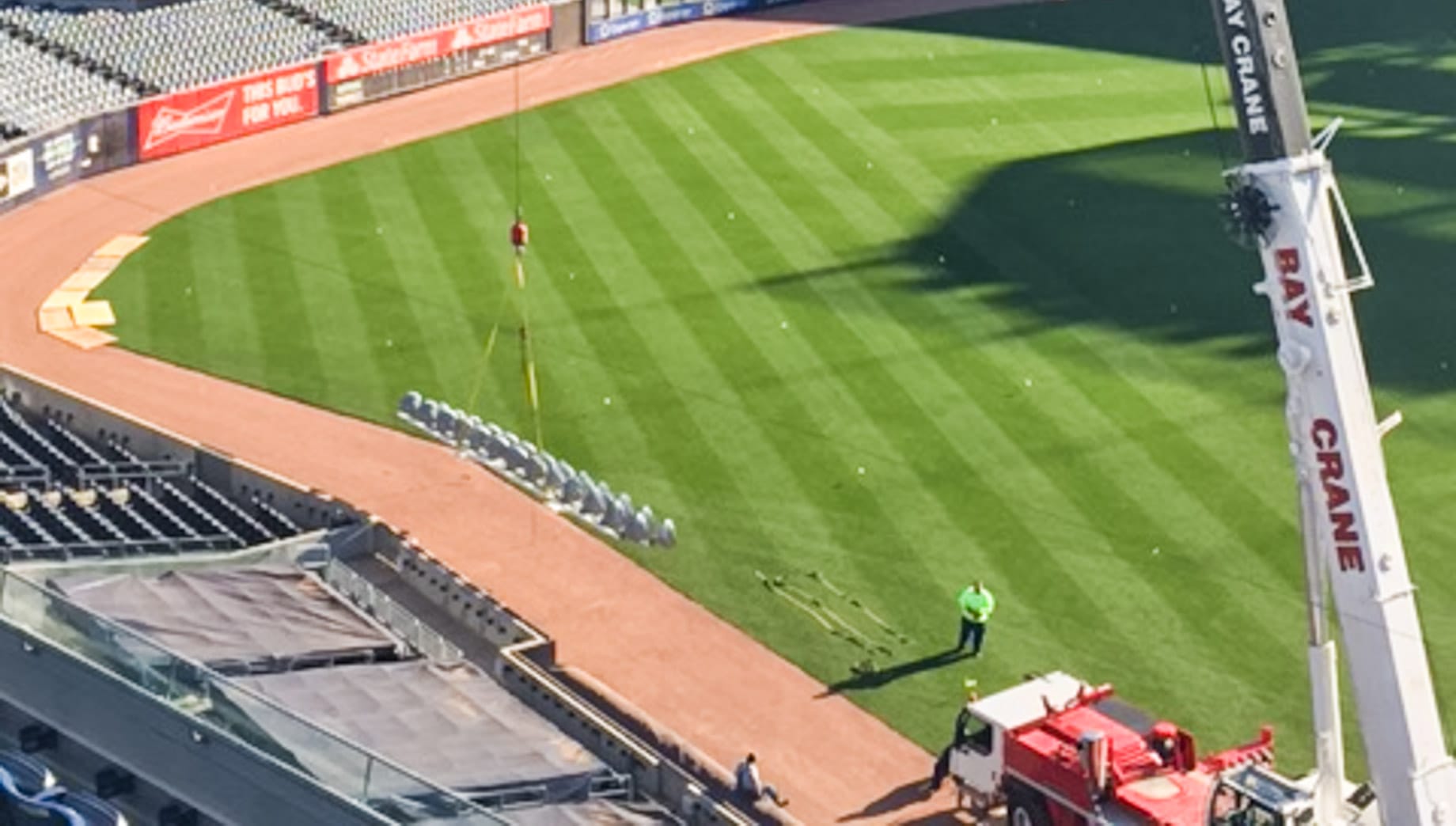 Crane lifting lights in Yankee Stadium