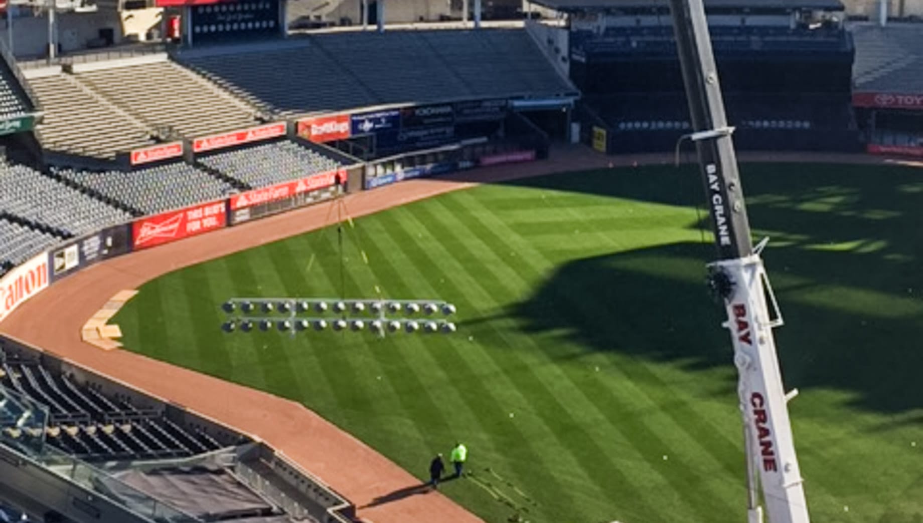 Crane lifting lights in Yankee Stadium