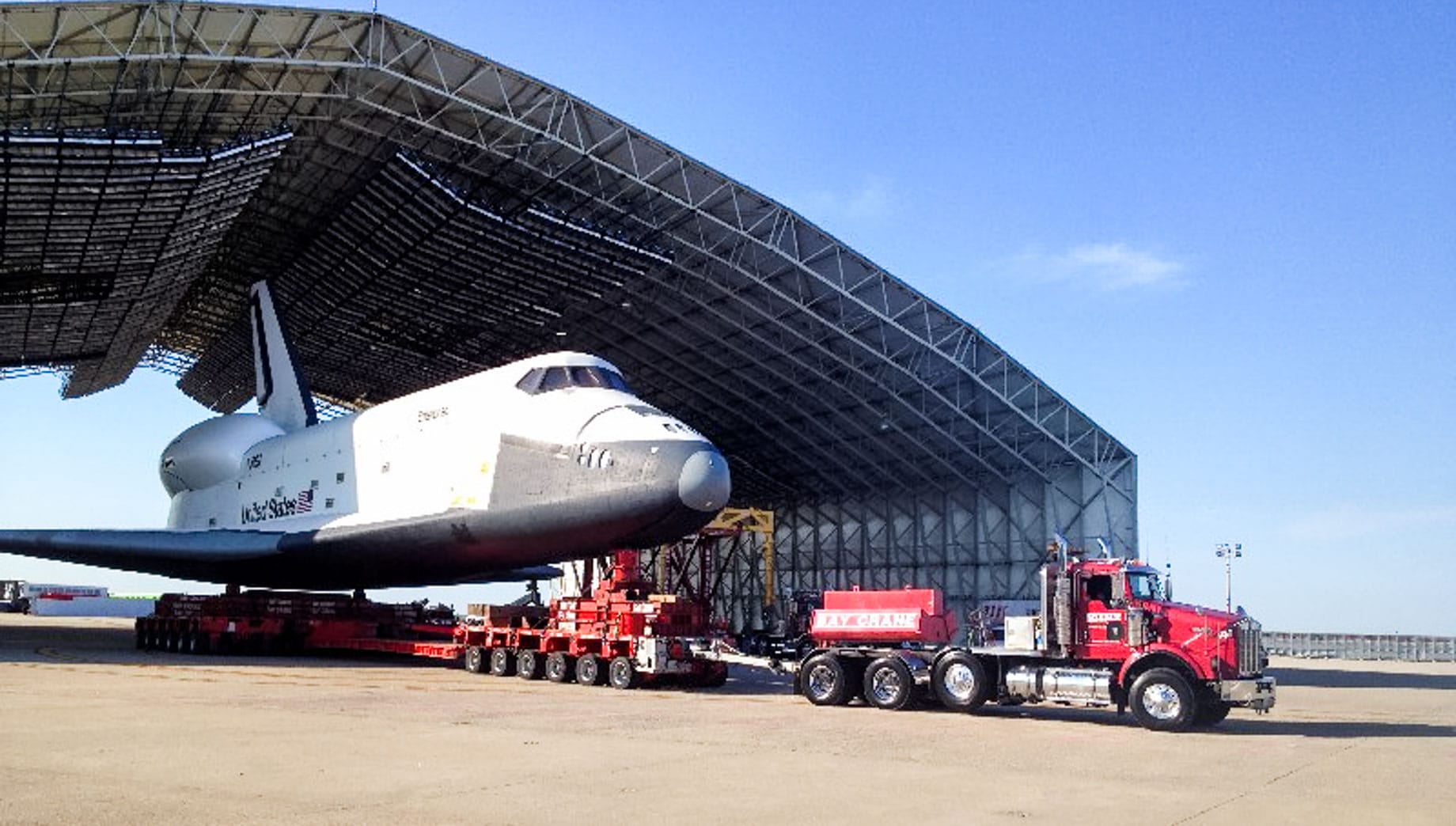 Truck transporting space shuttle from hangar