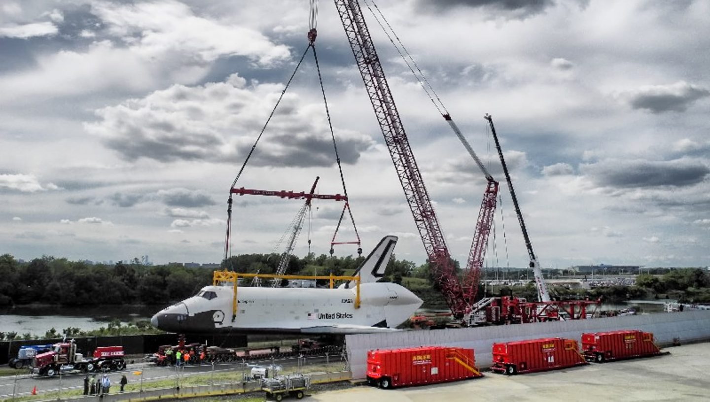 Crane lifting space shuttle