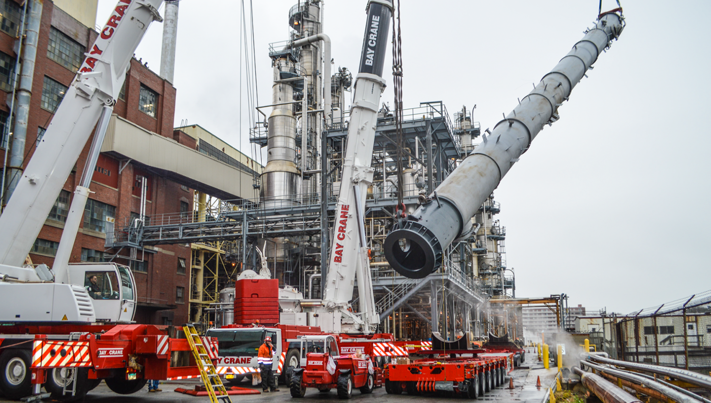 Cranes lifting heavy equipment