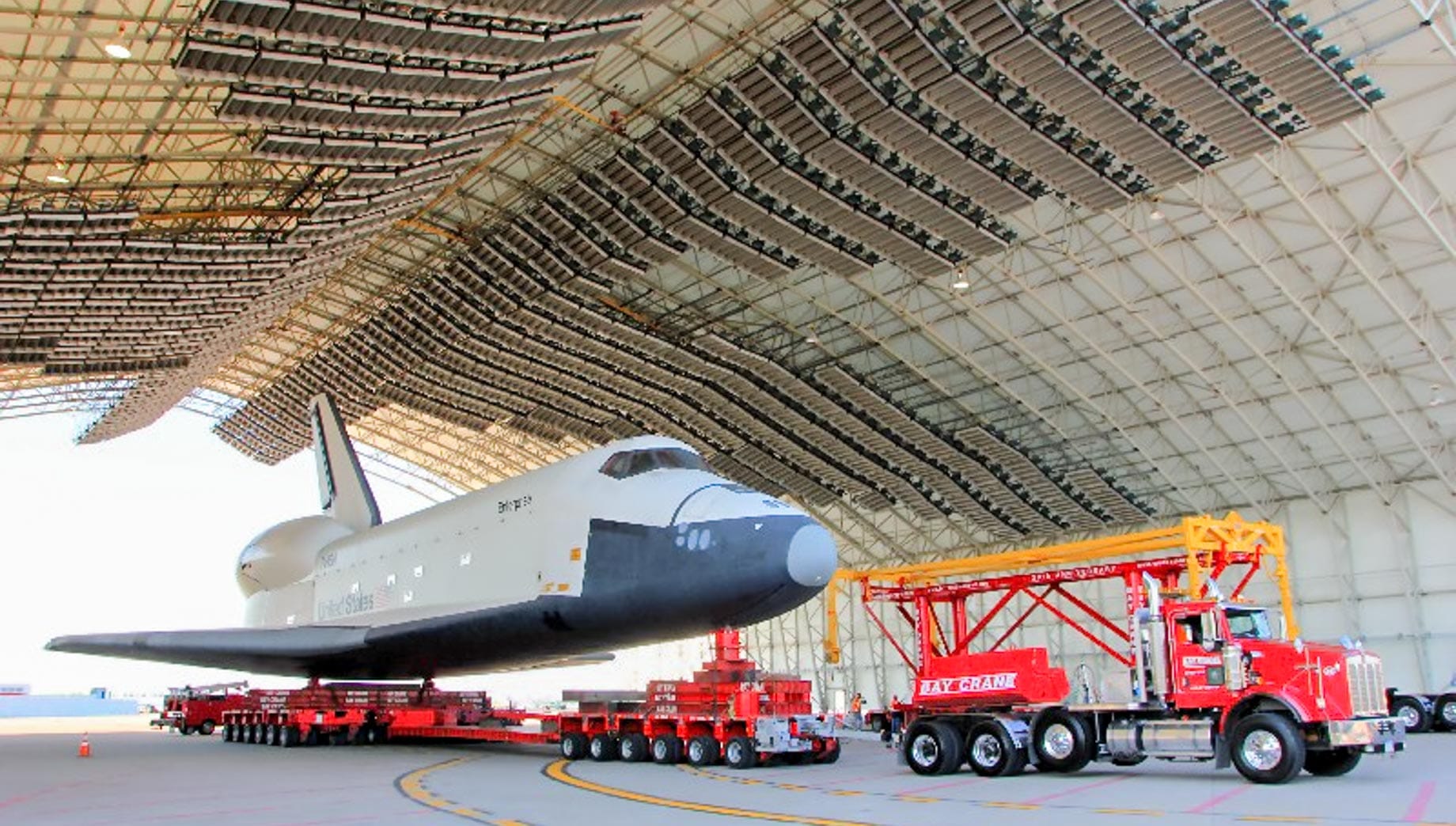 Truck transporting space shuttle from hangar